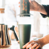 brewing coffee with aeropress into bru ceramic travel mug in aranya green