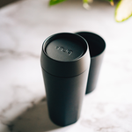 bru ceramic travel mug in black magic on marble surface